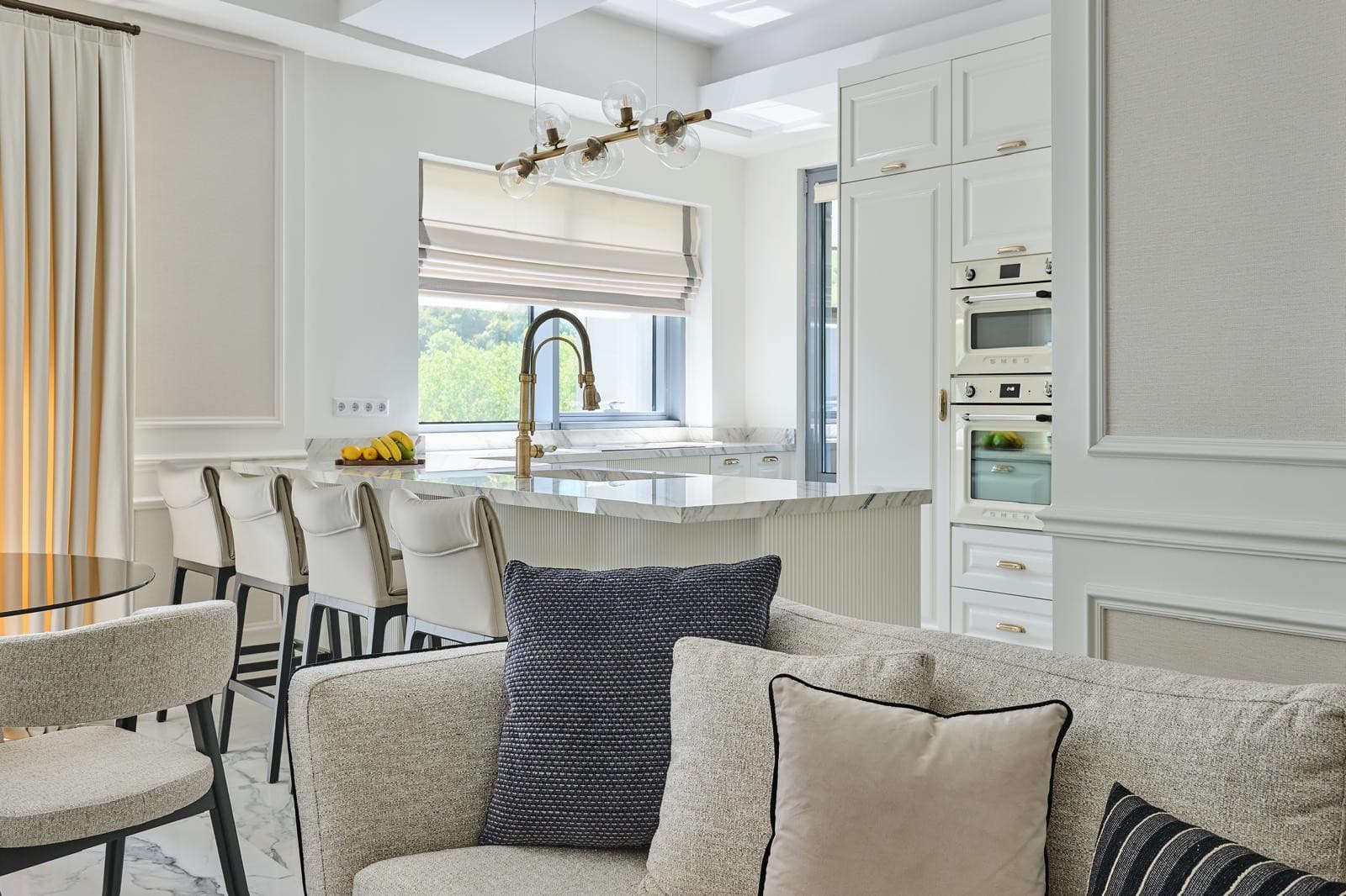 Marble kitchen island with brass fittings